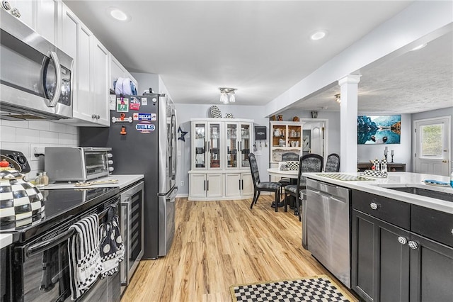 2033 Clarkson Parma Tl Rd, Clarkson, NY 14420 - kitchen featuring stainless steel appliances, light countertops, white cabinets, backsplash, and recessed lighting