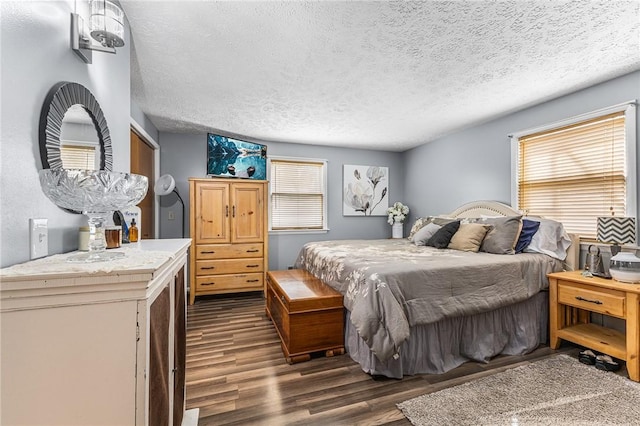 2033 Clarkson Parma Tl Rd, Clarkson, NY 14420 - bedroom with dark wood-style floors and a textured ceiling