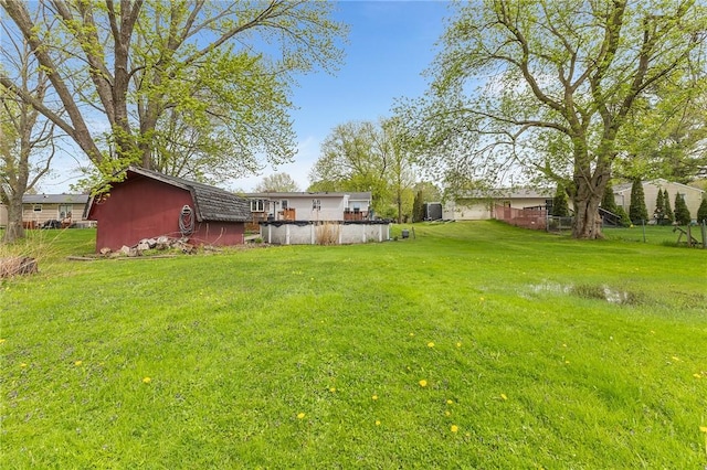2033 Clarkson Parma Tl Rd, Clarkson, NY 14420 - view of green lawn featuring a wooden deck
