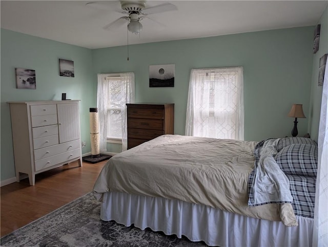 5 S Hartland St, Royalton, NY 14105 - bedroom with wood finished floors, multiple windows, baseboards, and ceiling fan