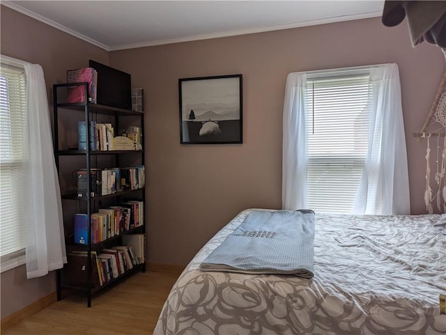 5 S Hartland St, Royalton, NY 14105 - bedroom featuring wood finished floors, crown molding, and baseboards