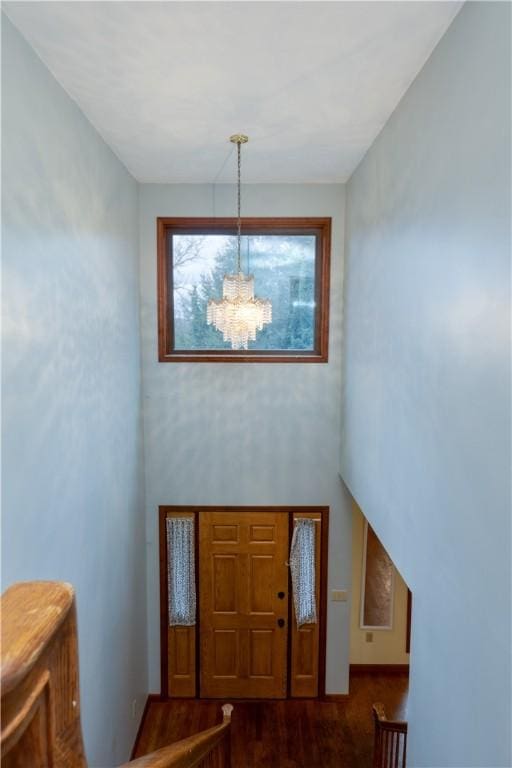 48 Hemlock Ln, Erwin, NY 14870 - foyer entrance with a chandelier, dark wood finished floors, and a high ceiling