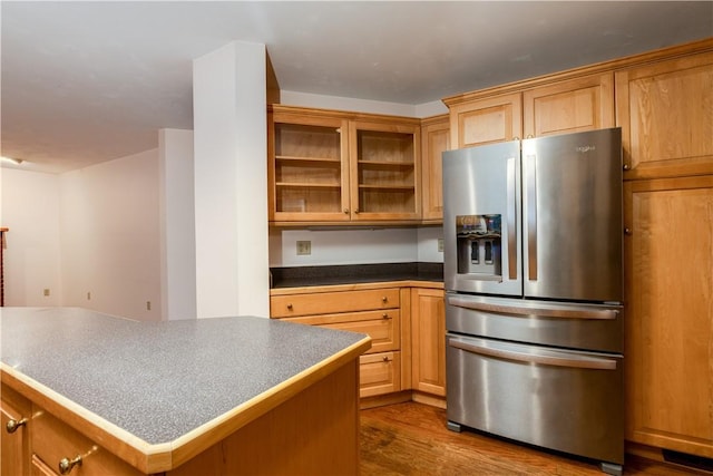 48 Hemlock Ln, Erwin, NY 14870 - kitchen with stainless steel fridge, dark wood finished floors, glass insert cabinets, a kitchen island, and dark countertops