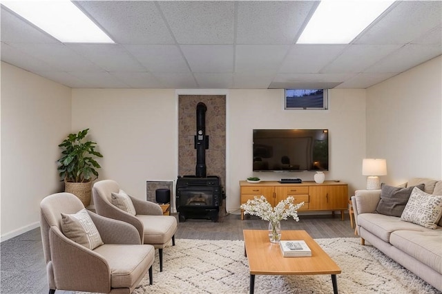 48 Hemlock Ln, Erwin, NY 14870 - living room featuring a wood stove, a drop ceiling, and wood finished floors