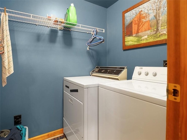 washroom featuring washer and clothes dryer