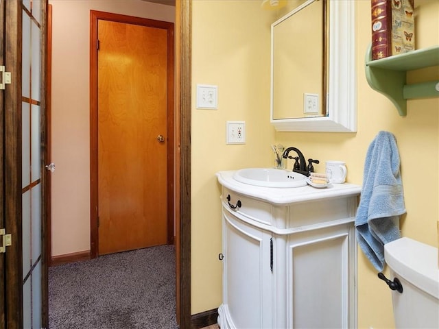 bathroom with vanity and baseboards