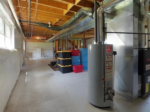 basement featuring water heater, heating unit, and heating fuel