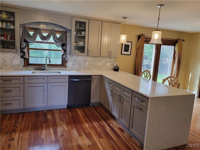 3130 Meadow View Ln, Sennett, NY 13021 - kitchen with a sink, dishwashing machine, a peninsula, gray cabinetry, and dark wood-style flooring