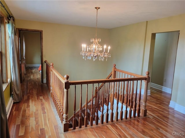 3130 Meadow View Ln, Sennett, NY 13021 - hall with an upstairs landing, wood finished floors, and baseboards
