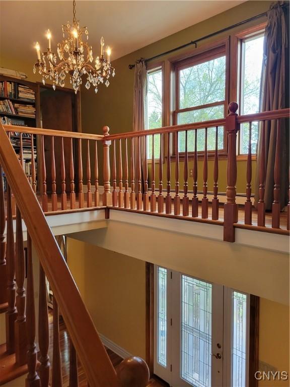 3130 Meadow View Ln, Sennett, NY 13021 - stairway featuring a chandelier