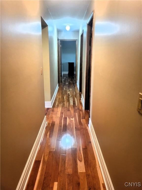 3130 Meadow View Ln, Sennett, NY 13021 - hallway with dark wood finished floors and baseboards