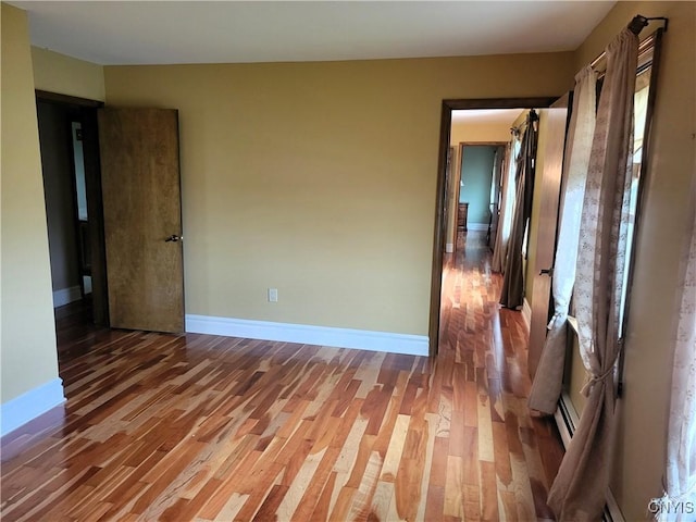 3130 Meadow View Ln, Sennett, NY 13021 - unfurnished room with light wood-style flooring, baseboards, and a baseboard heating unit