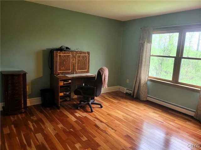 3130 Meadow View Ln, Sennett, NY 13021 - office with a baseboard heating unit, hardwood / wood-style floors, and baseboards