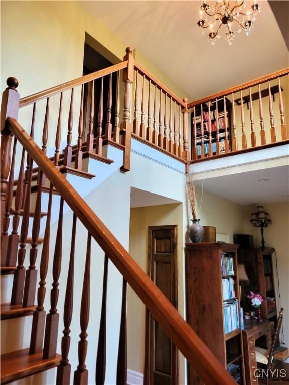 3130 Meadow View Ln, Sennett, NY 13021 - stairs with a chandelier and a towering ceiling