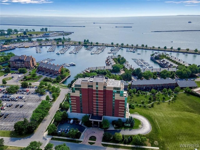 drone / aerial view of numerous boat docks and a nearby body of water