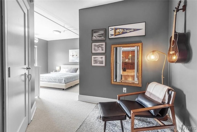 carpeted bedroom featuring baseboards