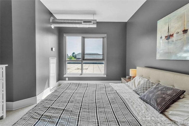 carpeted bedroom with baseboards