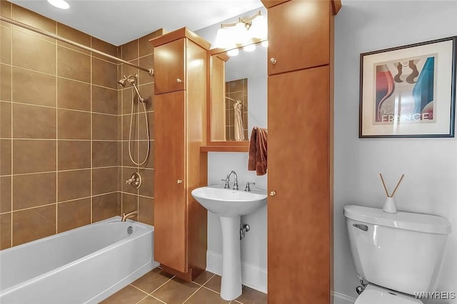 full bathroom with tile patterned flooring, shower / tub combination, toilet, and a sink