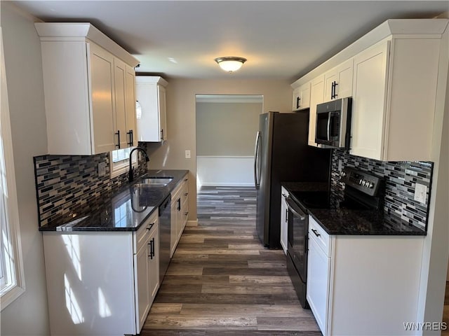 196 Montbleu Dr, Amherst, NY 14068 - kitchen featuring appliances with stainless steel finishes, a sink, dark wood-style floors, white cabinets, and decorative backsplash