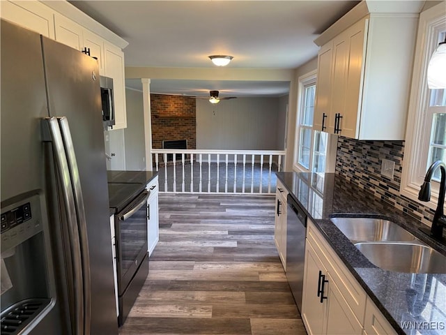 196 Montbleu Dr, Amherst, NY 14068 - kitchen featuring appliances with stainless steel finishes, a sink, dark wood-style flooring, ceiling fan, and white cabinets