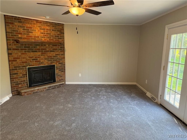 196 Montbleu Dr, Amherst, NY 14068 - unfurnished living room featuring carpet floors, a ceiling fan, a fireplace, crown molding, and baseboards