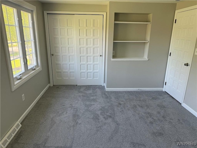 196 Montbleu Dr, Amherst, NY 14068 - unfurnished bedroom with carpet, baseboards, and multiple windows