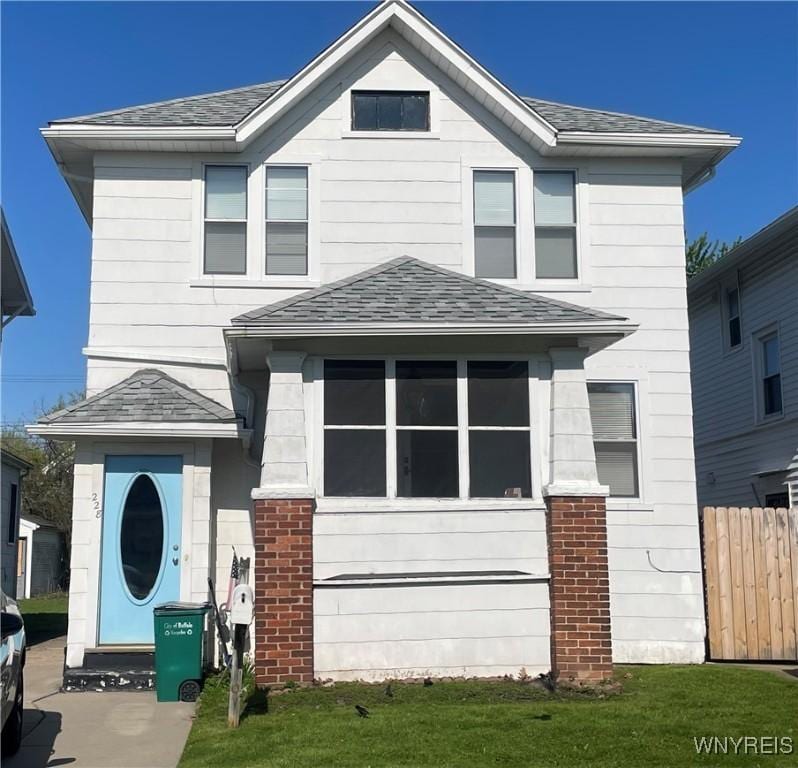 228 Norwalk Ave, Buffalo, NY 14216 - view of front of house with fence and a shingled roof