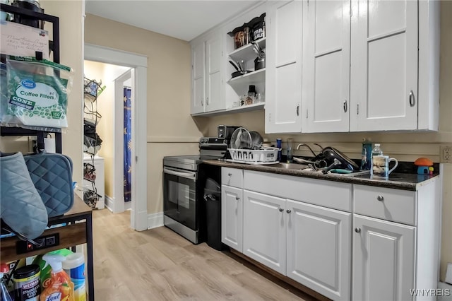 kitchen featuring open shelves, stainless steel electric range oven, dark countertops, and white cabinets
