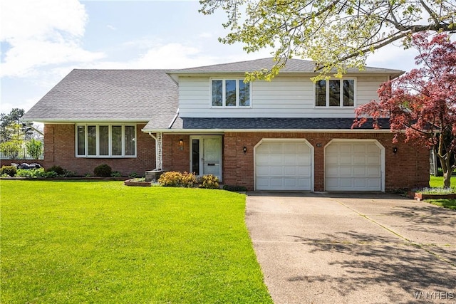 187 Dan Troy Dr, Amherst, NY 14221 - view of front of property with driveway, a garage, a front lawn, and brick siding