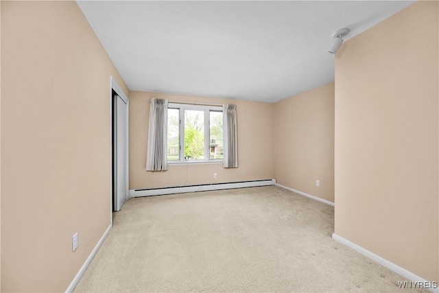 187 Dan Troy Dr, Amherst, NY 14221 - empty room with baseboard heating, light carpet, and baseboards