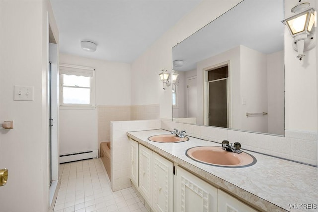 187 Dan Troy Dr, Amherst, NY 14221 - full bathroom featuring a baseboard heating unit, a stall shower, a garden tub, tile patterned floors, and double vanity