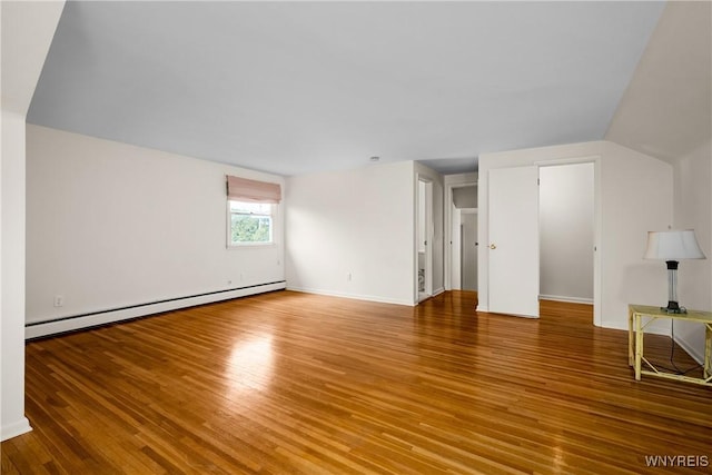 187 Dan Troy Dr, Amherst, NY 14221 - unfurnished living room featuring a baseboard radiator, wood finished floors, and baseboards