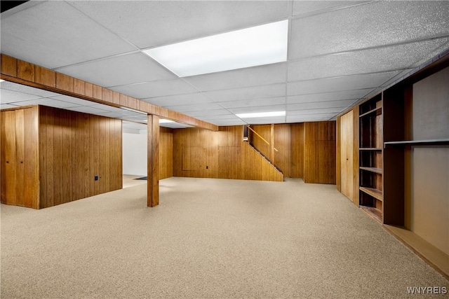 187 Dan Troy Dr, Amherst, NY 14221 - finished basement featuring wooden walls, carpet floors, a paneled ceiling, and stairway