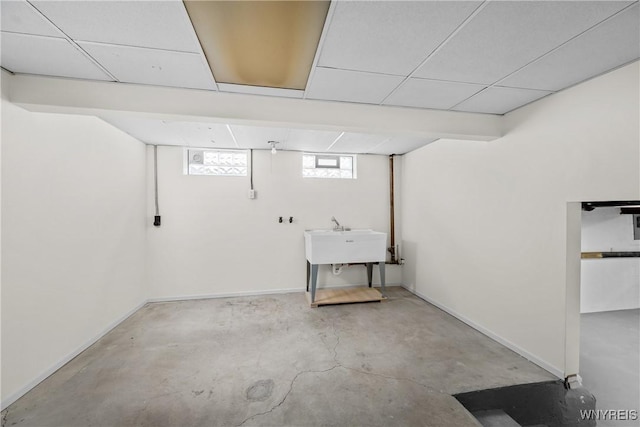 187 Dan Troy Dr, Amherst, NY 14221 - basement with baseboards, a paneled ceiling, and a sink