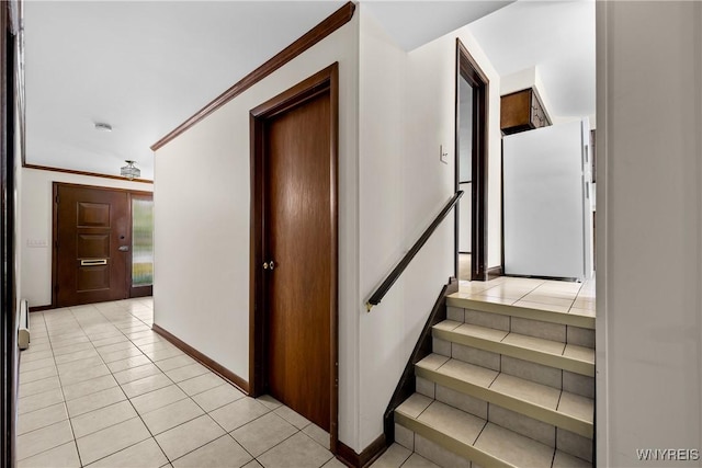 187 Dan Troy Dr, Amherst, NY 14221 - stairway featuring tile patterned floors, baseboards, and ornamental molding