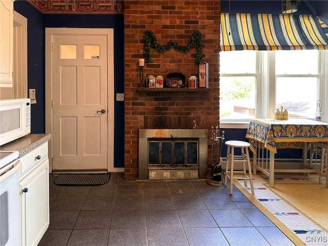 1401 Utica St, Whitestown, NY 13424 - living area featuring a brick fireplace and tile patterned flooring