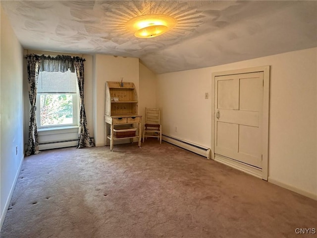 1401 Utica St, Whitestown, NY 13424 - carpeted empty room with a baseboard radiator, lofted ceiling, and baseboards