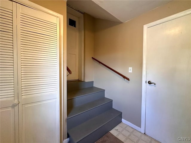 1401 Utica St, Whitestown, NY 13424 - staircase with tile patterned floors and baseboards