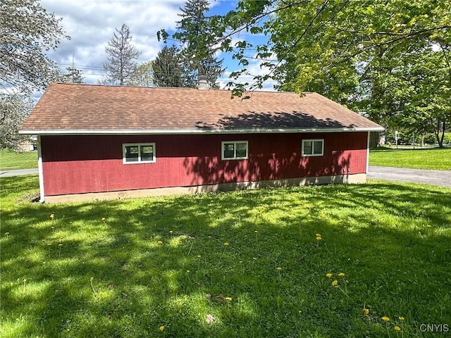 1401 Utica St, Whitestown, NY 13424 - view of front of property with a front yard, a chimney, and roof with shingles