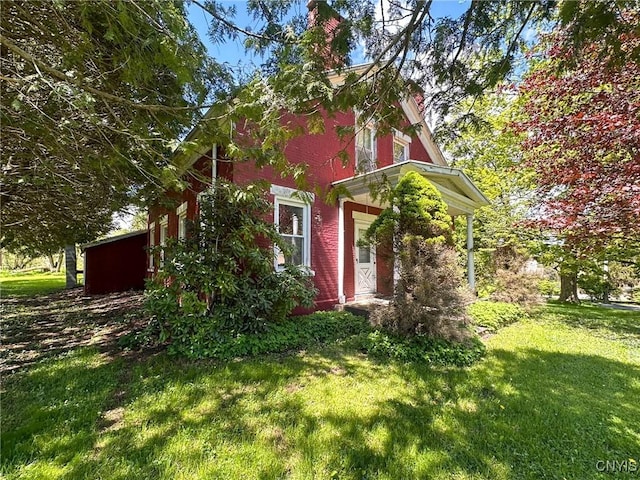 1401 Utica St, Whitestown, NY 13424 - view of home's exterior featuring a yard and a chimney