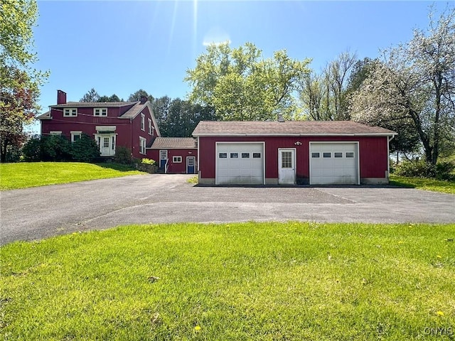 1401 Utica St, Whitestown, NY 13424 - garage featuring asphalt driveway