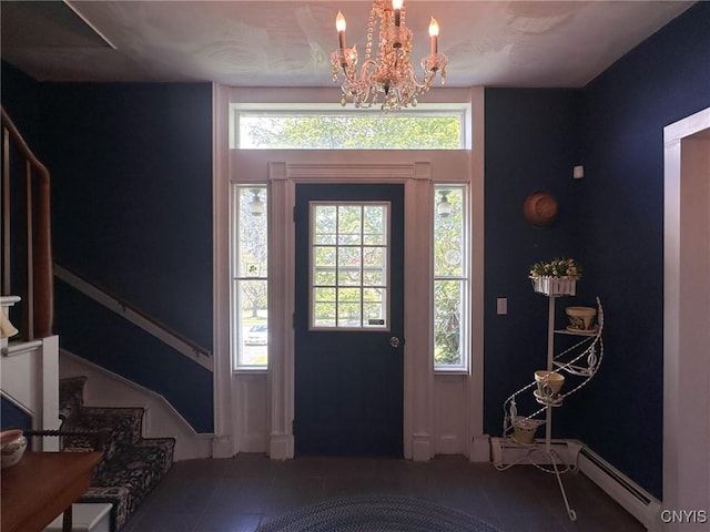 1401 Utica St, Whitestown, NY 13424 - foyer entrance featuring a baseboard heating unit, a chandelier, stairs, and tile patterned flooring