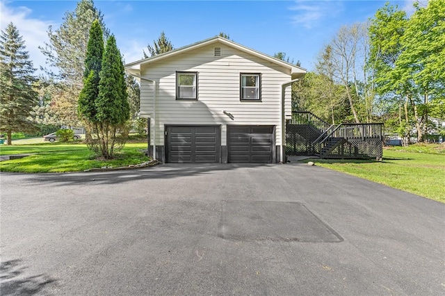 35 Squire Cir, Penfield, NY 14526 - view of side of home with driveway, an attached garage, a yard, and stairs