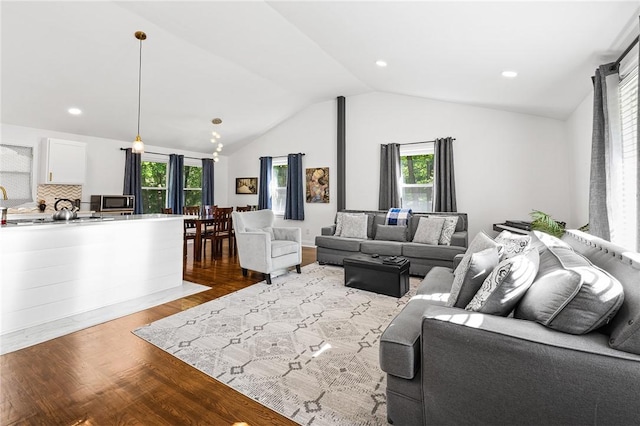 35 Squire Cir, Penfield, NY 14526 - living room with plenty of natural light, lofted ceiling, light wood finished floors, and recessed lighting