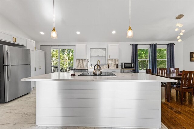 35 Squire Cir, Penfield, NY 14526 - kitchen featuring appliances with stainless steel finishes, plenty of natural light, tasteful backsplash, recessed lighting, and white cabinets