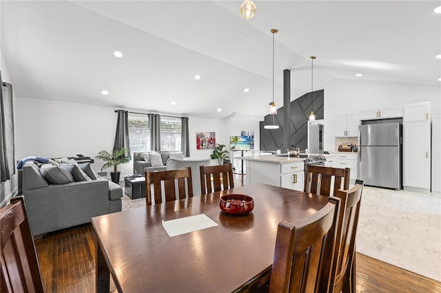 35 Squire Cir, Penfield, NY 14526 - dining area featuring lofted ceiling, recessed lighting, and light wood finished floors