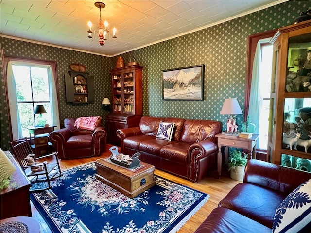 225 John Cook Rd, Unadilla, NY 13849 - living room with crown molding, wood finished floors, a chandelier, and wallpapered walls