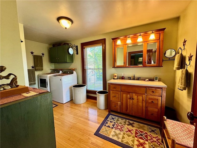 225 John Cook Rd, Unadilla, NY 13849 - washroom featuring washer and dryer, cabinet space, and light wood finished floors