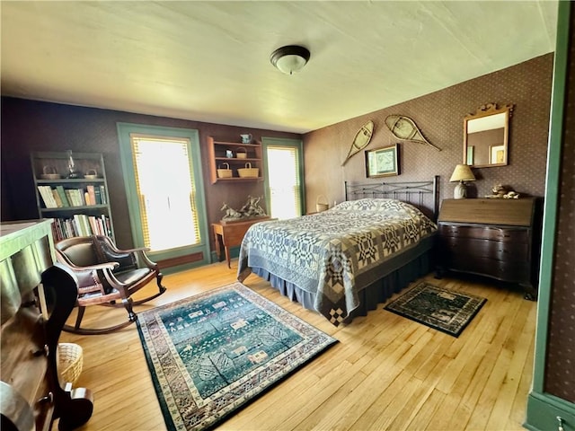 225 John Cook Rd, Unadilla, NY 13849 - bedroom with wallpapered walls and hardwood / wood-style floors