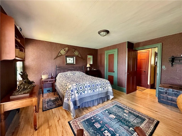 225 John Cook Rd, Unadilla, NY 13849 - bedroom with wallpapered walls and light wood-type flooring